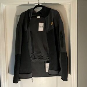Nike Black Jacket with Gold Logo